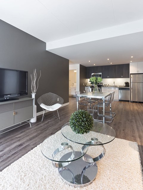 a living room with a table and a television